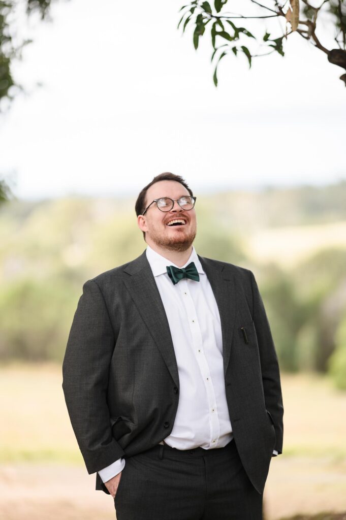 Sirromet wedding photography -Groom laughing