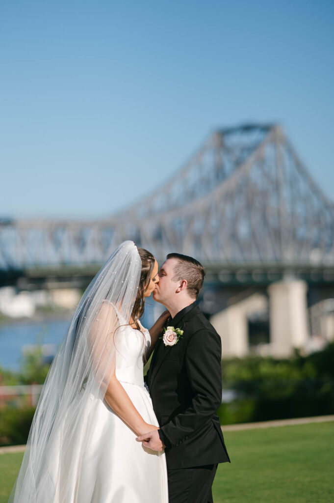 All Hallows Chapel Wedding - Bride & groom kiss