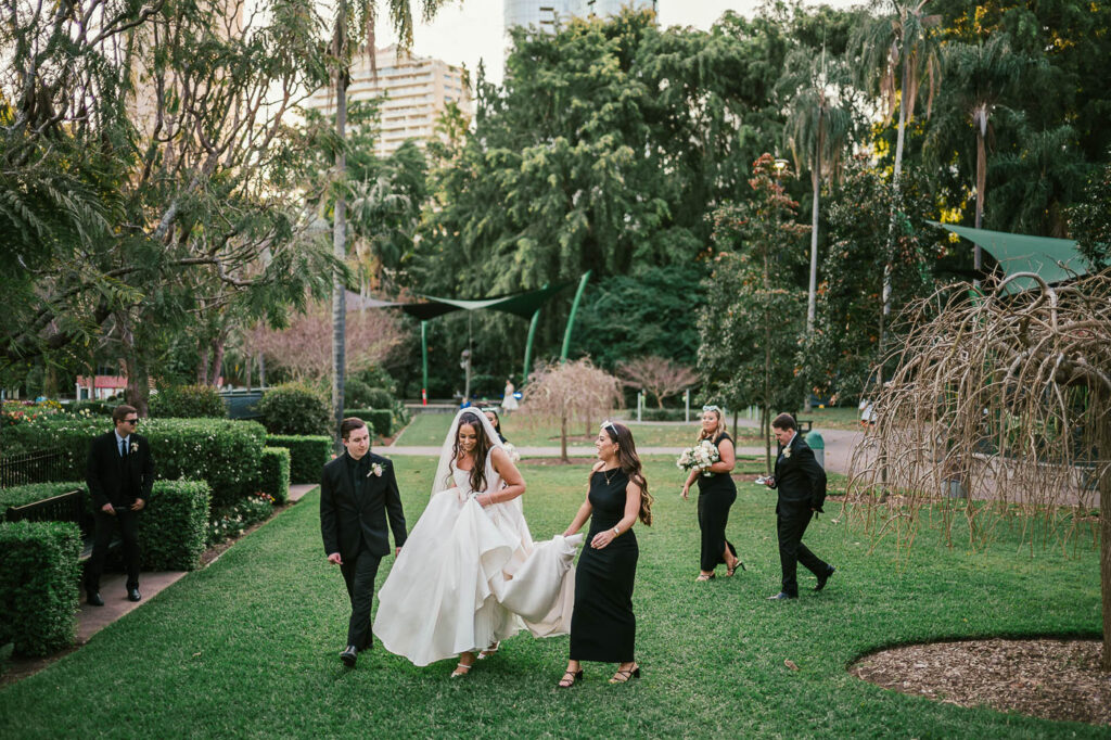 All Hallows Chapel Wedding - walking in park